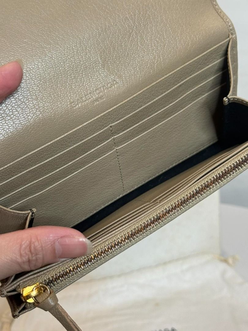 Balenciaga Grey Leather Zip Around Wallet (Category: Luxury Bags & Wallets) located in Las Pinas. Submitted by happystar_cac724 (Listing ID 1460600788, Image 3). Description: - Authentic Balenciaga wallet in stylish grey leather. - Elegant gold hardware accents. - Secure zip-around closure. - Interior features multiple card slots and compartments for excellent organization. - Comes with original dust bag. - Perfect for keeping your essentials tid