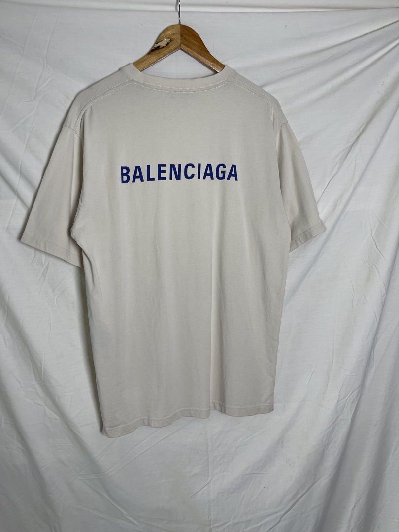 Balenciaga Logo T-Shirt (Category: Tshirts & Polo Shirts ) located in Manila. Submitted by noahcastilljos363 (Listing ID 1460557930, Image 2). Description: - Brand: Balenciaga - Color: Light Beige - Size: M - Material: Good quality cotton - Features: Balenciaga logo on front left chest, larger logo across the back - Style: Great for casual wear.