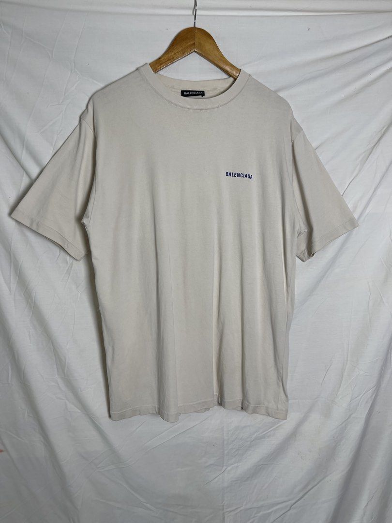 Balenciaga Logo T-Shirt (Category: Tshirts & Polo Shirts ) located in Manila. Submitted by noahcastilljos363 (Listing ID 1460557930, Image 1). Description: - Brand: Balenciaga - Color: Light Beige - Size: M - Material: Good quality cotton - Features: Balenciaga logo on front left chest, larger logo across the back - Style: Great for casual wear.