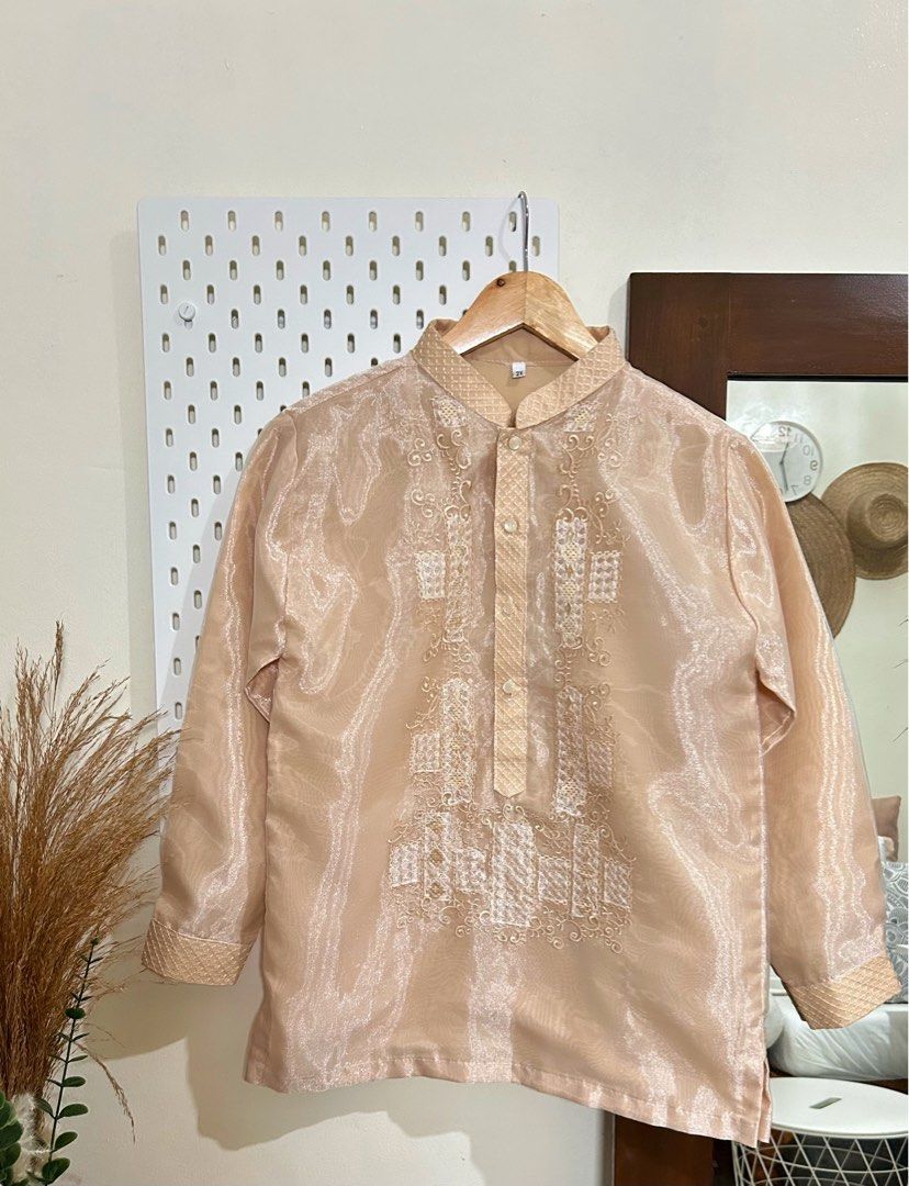 Barong Tagalog Set (Category: Babies & Kids Fashion) located in Manila. Submitted by maison_marie (Listing ID 1460688400, Image 2). Description: Elegant Chinese-collar barong set for boys, featuring a traditional embroidered design with matching dark pants. Perfect for Buwan ng Wika, school events, formal occasions, and cultural celebrations. SOLD AS SET Barong: Size: 2XL Bought from 🍊app (799.00) Pants: Size: 12 Length: 33.5 inches Bought from 