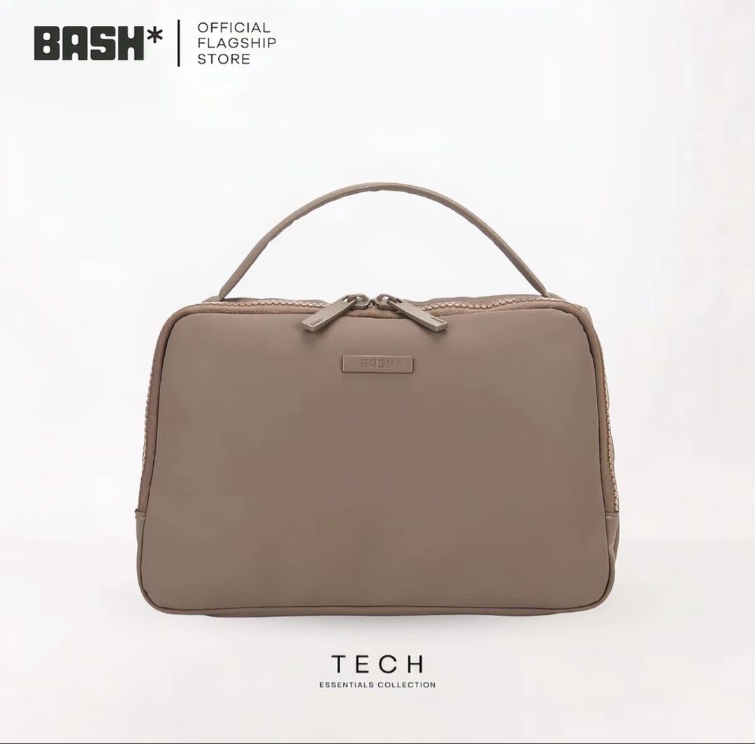 BASH* | ESSENTIALS TECH ORGANIZER (Category: Purses & Pouches) located in Quezon City. Submitted by avenue.de.belle (Listing ID 1460557333, Image 1). Description: BASH* | ESSENTIALS TECH ORGANIZER • Oak • Sakura 23cm (L) × 8cm (W) x 15cm (H) - Solid-toned color with matte-finished logo - Top-handle organizer with zip main compartment closure - Matte finish hardware - Semi-structured construction - With two intertior gartered mesh pockets - With v