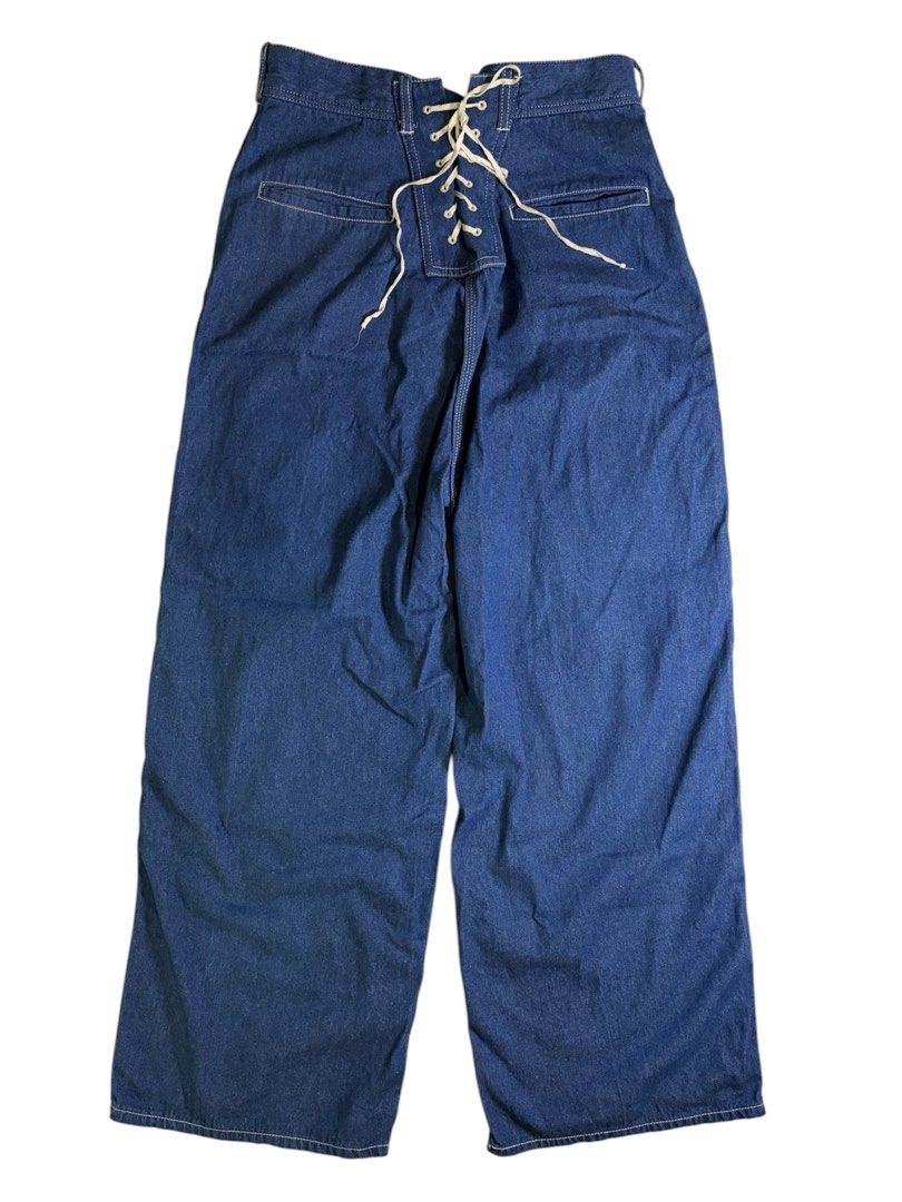 BEAMS BOY Lace-up Work Pants (Category: Jeans) located in Abucay. Submitted by esangbalakalang (Listing ID 1460524313, Image 3). Description: These BEAMS BOY Lace-up Work Pants showcase a distinct wide-leg silhouette heavily inspired by vintage 1930s military deck pants and traditional naval sailor uniforms. Crafted from a mid-weight, deep indigo blue denim, the centerpiece of the design is a prominent, contrast-stitched corset lace-up panel inte