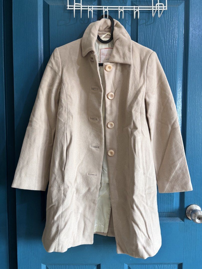 Beige Coat For Winter and Autumn (Category: Coats, Jackets and Outerwear) located in Makati City. Submitted by yunivances (Listing ID 1460522065, Image 2). Description: Classic Thick Beige Coat For Winter and Autumn Trips Missing One Button (not noticeable) Has Pockets No Zipper.