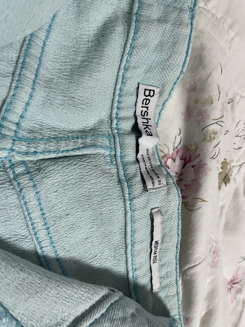 Bershka Light Blue Distressed Denim Shorts (Category: Shorts) located in Pasig City. Submitted by arabellesantamariaa (Listing ID 1460631056, Image 3). Description: - Brand: Bershka - Color: Light Blue Denim - Style: High-waisted shorts - Details: Distressed, frayed hem - Closure: Zipper and button - Fit: EU 40 - Occasion: Casual wear.