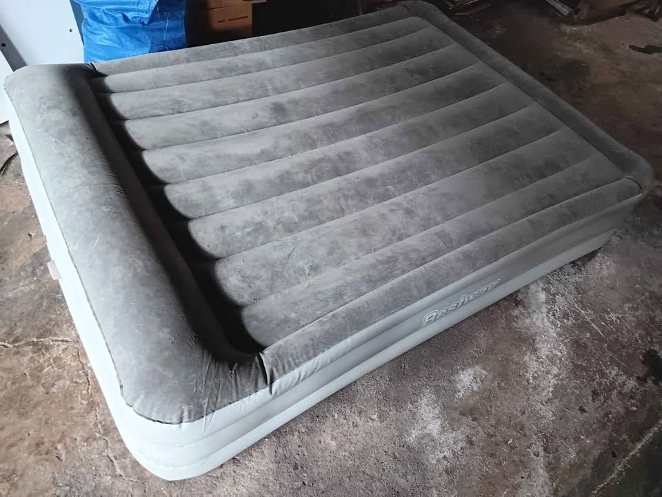 Bestway Air Mattress with Built-in Pump (Category: Bed Frames & Mattresses) located in Pasay City. Submitted by enrico_appliances (Listing ID 1460558749, Image 2). Description: - Bestway inflatable air mattress - Built-in pump for easy inflation/deflation - Ideal for guests or camping - Comfortable flocked top surface - Ready for immediate use Approx. Meas.: L 75" x W 58" x H 35" (inches) -Brand: BESTWAY -Features: Electric inflating function; Do