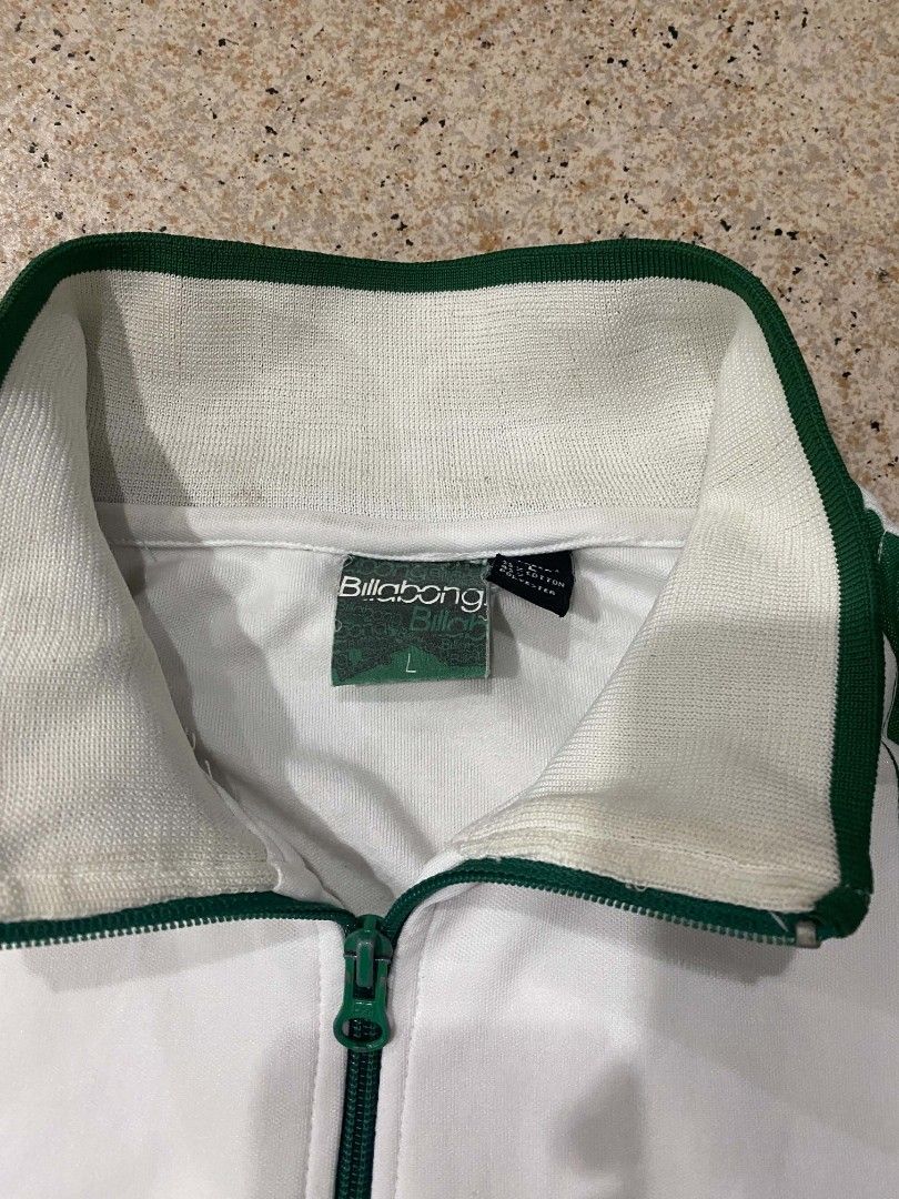 Billabong White Green Track Jacket Size L (Category: Coats, Jackets and Outerwear) located in Manila. Submitted by undrgrntrift (Listing ID 1460687327, Image 3). Description: - Billabong track jacket - Color: White and Green - Logo on chest and back - Classic track jacket style - Zip-up front - Ribbed cuffs and hem - Size: L - Ideal for casual wear or layering.