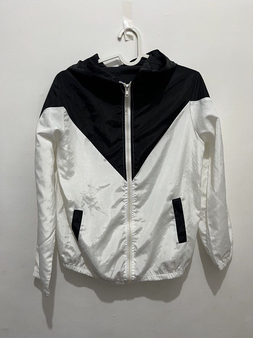 Black and White Hooded Windbreaker Jacket (Category: Coats, Jackets and Outerwear) located in Manila. Submitted by jonalainea95245 (Listing ID 1460708247, Image 2). Description: - Stylish black and white windbreaker jacket - Features a convenient hood and zipper closure - Two practical side pockets - Made with lightweight material for comfort - RFS: decluttering - Location: Malabon.