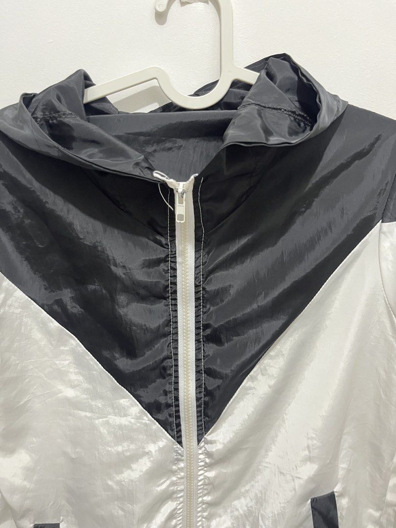 Black and White Hooded Windbreaker Jacket (Category: Coats, Jackets and Outerwear) located in Manila. Submitted by jonalainea95245 (Listing ID 1460708247, Image 3). Description: - Stylish black and white windbreaker jacket - Features a convenient hood and zipper closure - Two practical side pockets - Made with lightweight material for comfort - RFS: decluttering - Location: Malabon.
