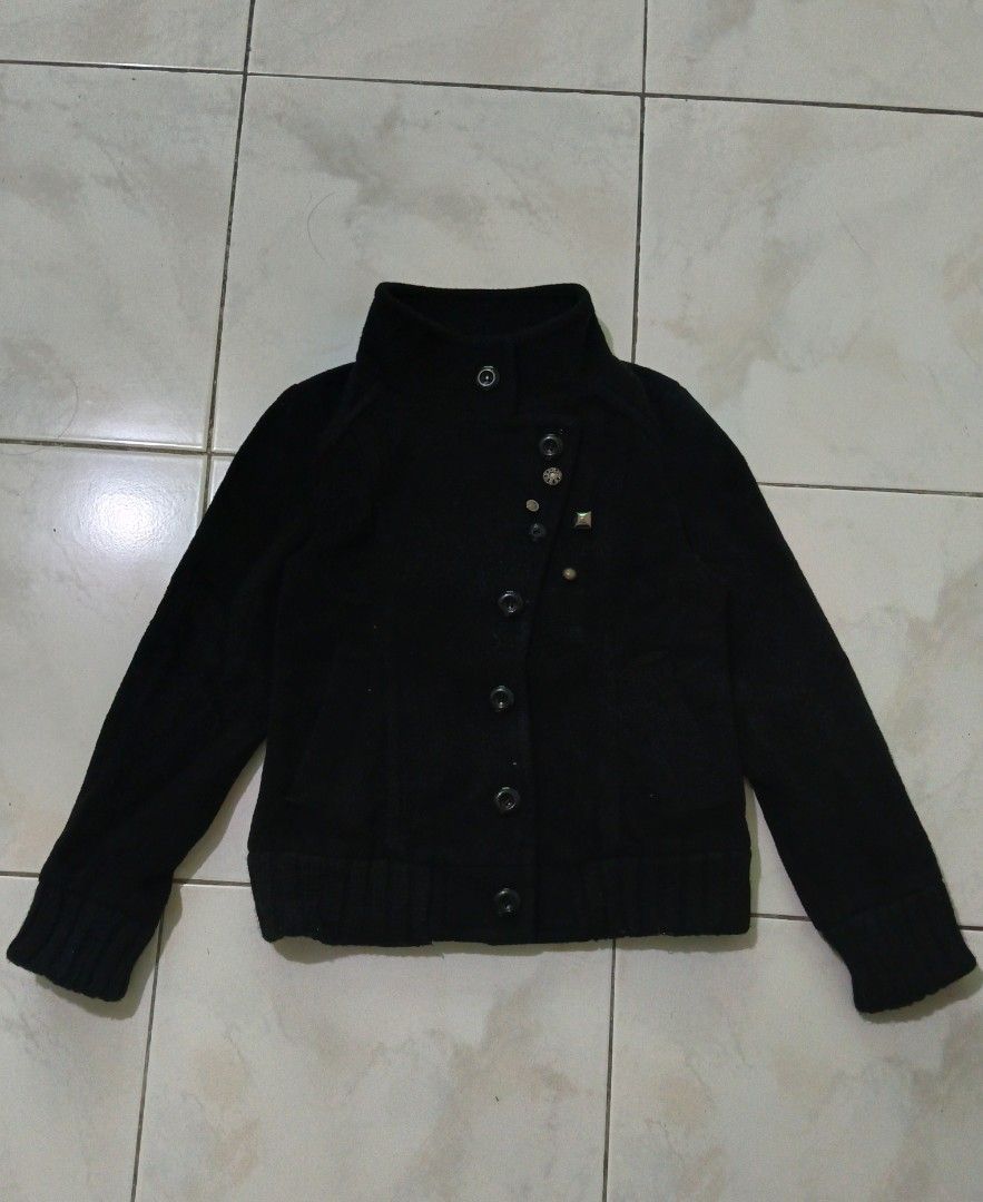 Black Button-Up Jacket with Stud Detail (Category: Coats, Jackets and Outerwear) located in Manila. Submitted by nostalgic.curated (Listing ID 1460513133, Image 2). Description: - Vintage black jacket with a collared neckline - Button-up front for easy wear - Ribbed cuffs and hem for a comfortable fit - Unique stud embellishment on one lapel for added detail - Versatile for layering, pairs well with jeans or dressier outfits.