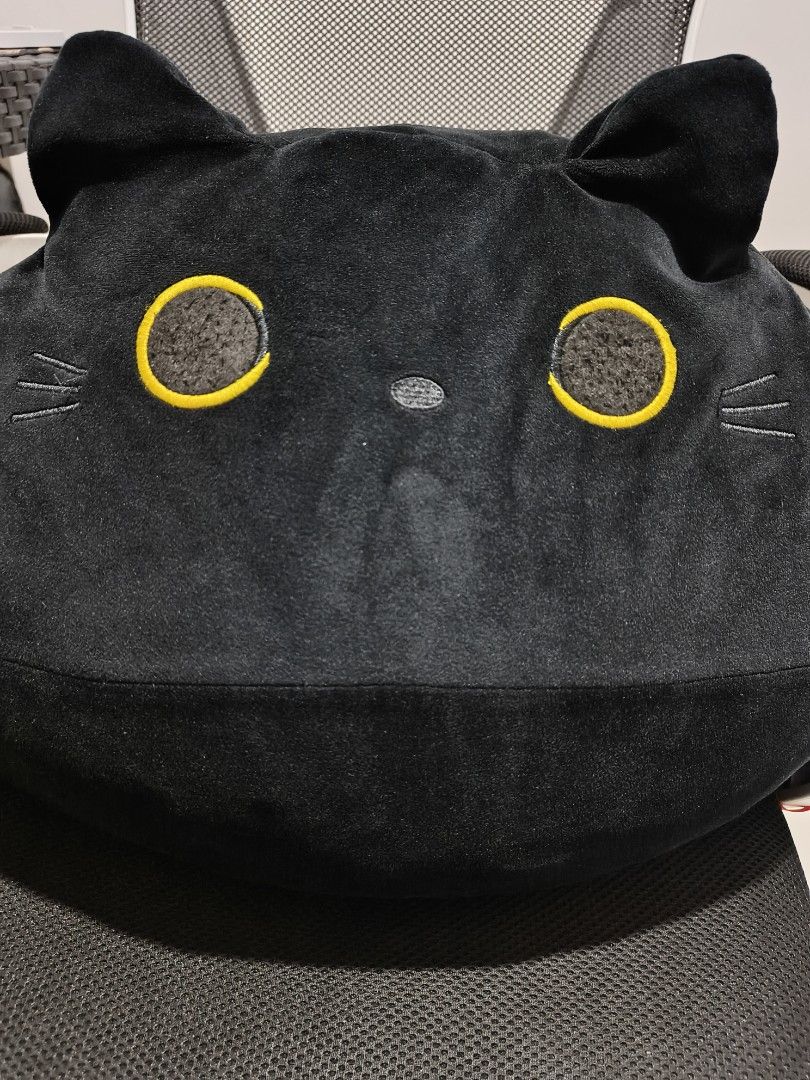 Black Cat Plush Pillow Cushion (Category: Plushies & Soft Toys) located in Tuguegarao City. Submitted by domzaiii (Listing ID 1460649950, Image 1). Description: - Super soft black cat plush pillow - Round and squishy design, perfect for hugging - Adorable details: yellow-ringed eyes with textured centers - Cute tail sticking out the back - Ideal gift for cat lovers or anyone who enjoys cute decor.