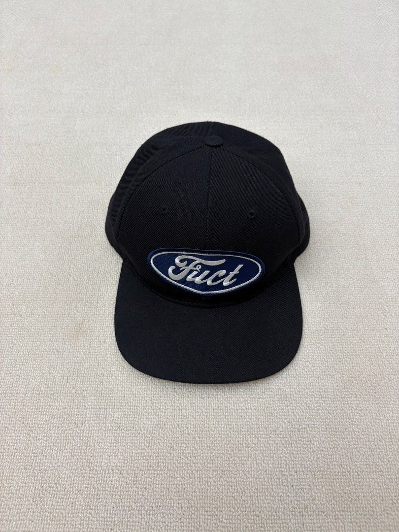 Black Ford "Fuct" Patch Baseball Cap (Category: Caps & Hats) located in Manila. Submitted by porma.market (Listing ID 1460518988, Image 2). Description: - Classic black baseball cap - Navy blue oval patch with white border - 'Fuct' logo in white lettering on patch - Made in the U.S.A. with imported material - Adjustable strap at the back for a custom fit - Perfect for casual wear.