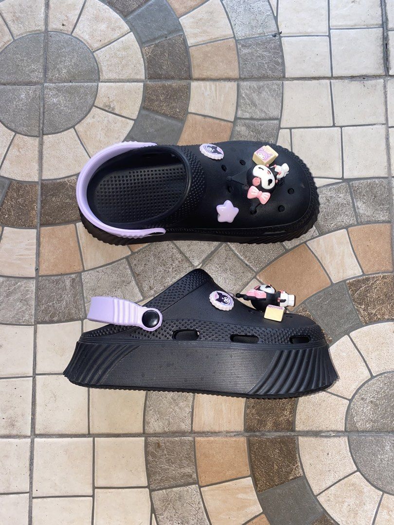 Black Kuromi Clogs with Charms Size 38 (Category: Slippers and slides) located in Pasay City. Submitted by violetttttttttttttt (Listing ID 1460579495, Image 3). Description: - Cute black clogs with adorable Kuromi charms - Features a light purple strap and sole accents - Wavy patterned sole for enhanced grip - Size 38 - Ideal for casual wear and lounging - Fun and playful design - Bought in Bangkok, Thailand.