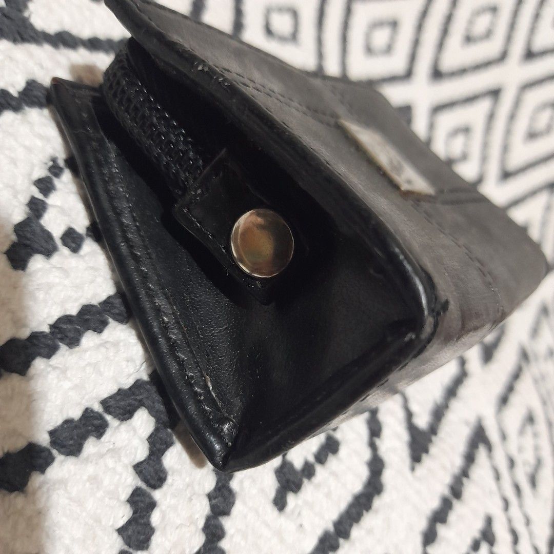 Black Leather Wallet with Zipper and Snap Closure (Category: Wallets & Card holders) located in Bocaue. Submitted by marajapansurplus (Listing ID 1460644757, Image 3). Description: - selling as it is - Genuine black leather wallet - Secure dual closure: zipper on one side, snap on the other - Elegant 'Mavi Lu' metal logo accent - Ample space for cards and cash - Ideal for everyday practicality and style.