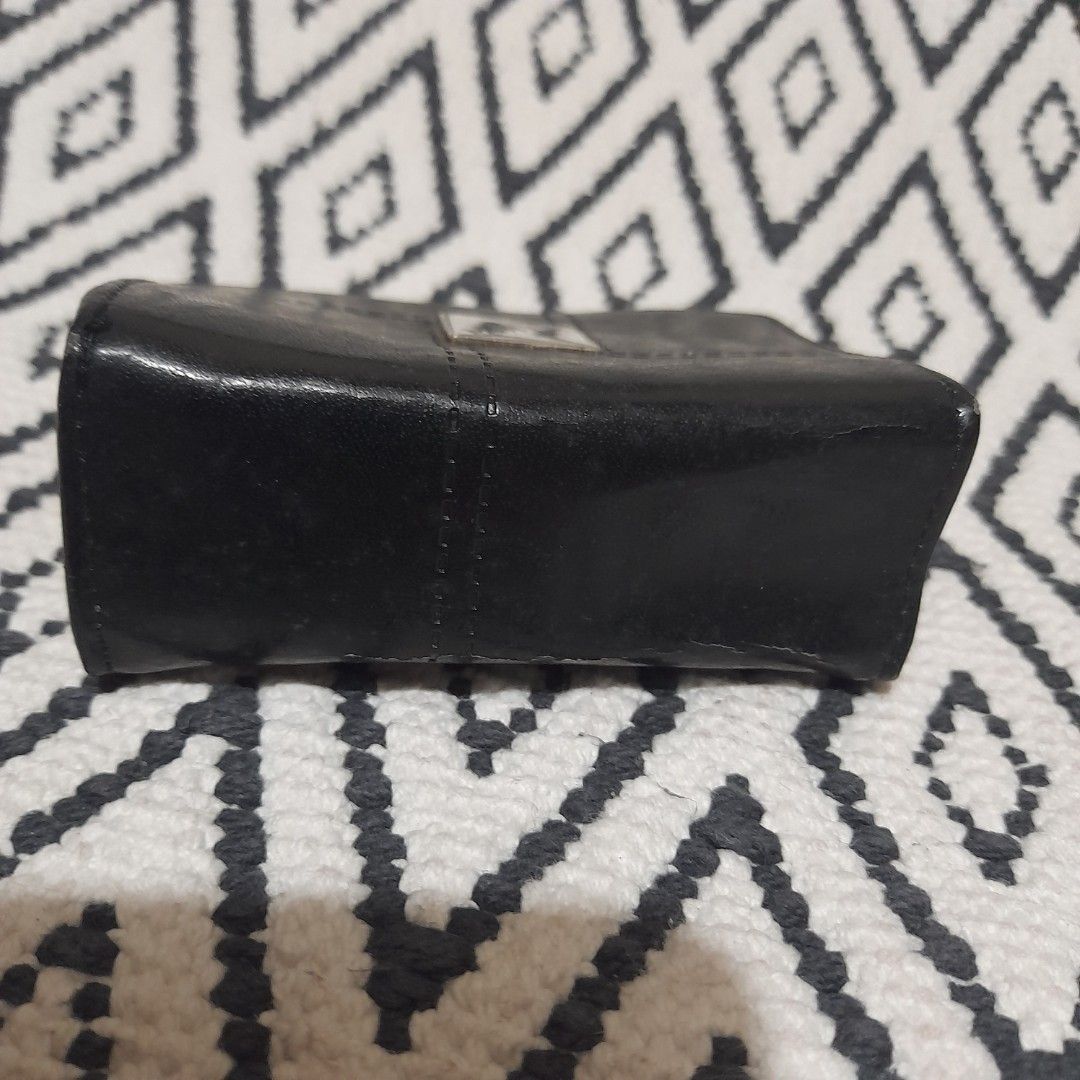 Black Leather Wallet with Zipper and Snap Closure (Category: Wallets & Card holders) located in Bocaue. Submitted by marajapansurplus (Listing ID 1460644757, Image 2). Description: - selling as it is - Genuine black leather wallet - Secure dual closure: zipper on one side, snap on the other - Elegant 'Mavi Lu' metal logo accent - Ample space for cards and cash - Ideal for everyday practicality and style.