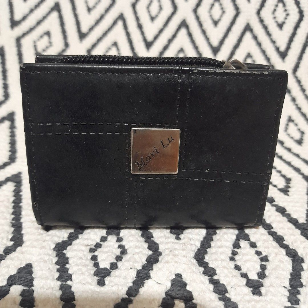 Black Leather Wallet with Zipper and Snap Closure (Category: Wallets & Card holders) located in Bocaue. Submitted by marajapansurplus (Listing ID 1460644757, Image 1). Description: - selling as it is - Genuine black leather wallet - Secure dual closure: zipper on one side, snap on the other - Elegant 'Mavi Lu' metal logo accent - Ample space for cards and cash - Ideal for everyday practicality and style.