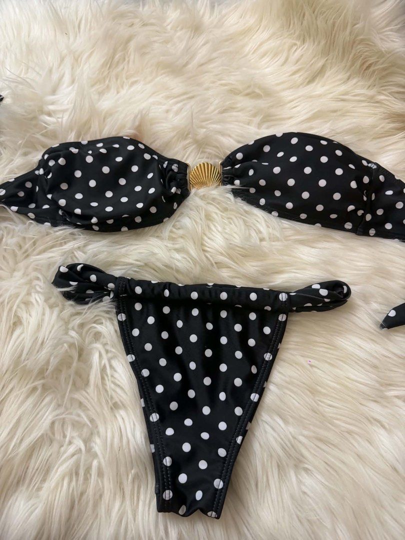 Black Polka Dot Bikini with Shell Detail (Category: Bikinis & Swimsuits) located in Bacoor. Submitted by hazimist (Listing ID 1460517117, Image 1). Description: - Cute black and white polka dot pattern - Bandeau bikini top - Gold shell detail in the center of the top - Bikini bottoms with adjustable tie sides - Ideal for beach days or pool parties - Perfect for your next vacation!.