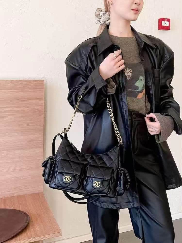 Black Quilted Shoulder Bag with Gold Chain (Category: Shoulder Bags) located in Manila. Submitted by maryjoyenc89891 (Listing ID 1460668118, Image 3). Description: Chanel fashion bag not auth but quality puffer type - Stylish black shoulder bag with elegant quilted design. - Features two convenient front pockets with secure snap closures. - Spacious main compartment with a reliable zipper. - Includes a luxurious gold chain strap for a chic look. 