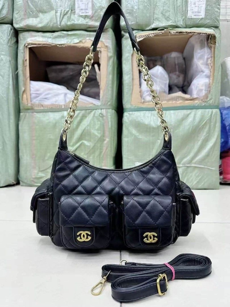 Black Quilted Shoulder Bag with Gold Chain (Category: Shoulder Bags) located in Manila. Submitted by maryjoyenc89891 (Listing ID 1460668118, Image 1). Description: Chanel fashion bag not auth but quality puffer type - Stylish black shoulder bag with elegant quilted design. - Features two convenient front pockets with secure snap closures. - Spacious main compartment with a reliable zipper. - Includes a luxurious gold chain strap for a chic look. 