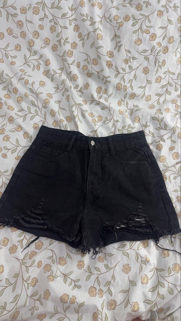 Black Ripped Denim Shorts (Category: Shorts) located in Taytay. Submitted by _daphnnie.21 (Listing ID 1460628485, Image 1). Description: - High-waisted black denim shorts - Distressed ripped details on the front - Button and zip closure - Raw hemline - Ideal for casual wear - Versatile, pairs easily with any top.