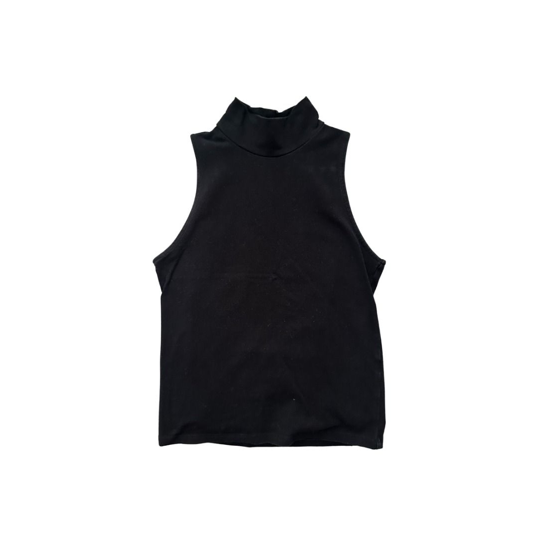 Black Sleeveless Turtleneck Top (Category: Sleeveless) located in Manila. Submitted by _swaganikaa (Listing ID 1460685123, Image 1). Description: Basic black sleeveless turtleneck top. Stretchy material. Good for layering or wearing on its own. Simple and versatile piece for any wardrobe. Easy to pair with skirts, shorts, or pants..