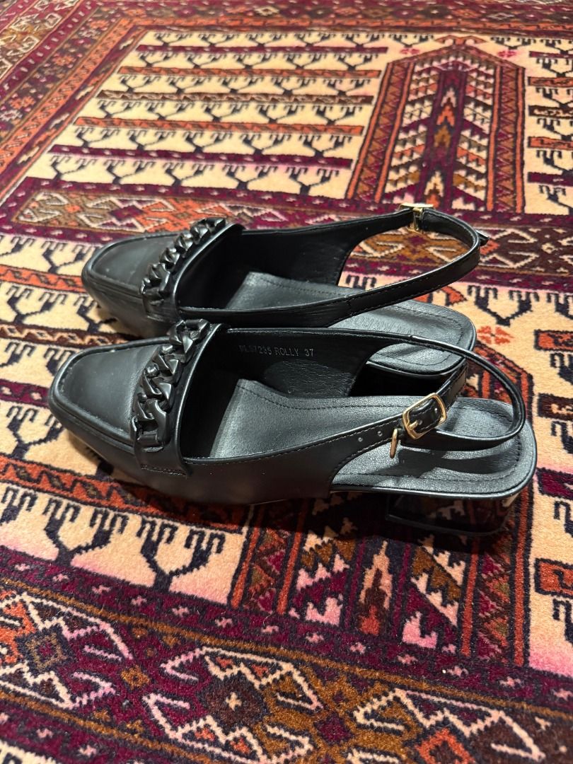 ROCK & ROSE Black Chain Slingback Loafer Heels (37 / Orig ₱1,499) (Category: Loafers) located in Makati City. Submitted by fpled (Listing ID 1460680718, Image 2). Description: ✨ ROCK & ROSE "ROLLY" BLACK CHAIN SLINGBACK LOAFER HEELS ✨ • Size US 6.5–7 • Landmark Original Tag Included (Retail: ₱1,499) Rock & Rose slingback loafer heels!--Designed with a modern structured square toe, a sturdy low block heel (~1.5) for all-day walking comfort, and an
