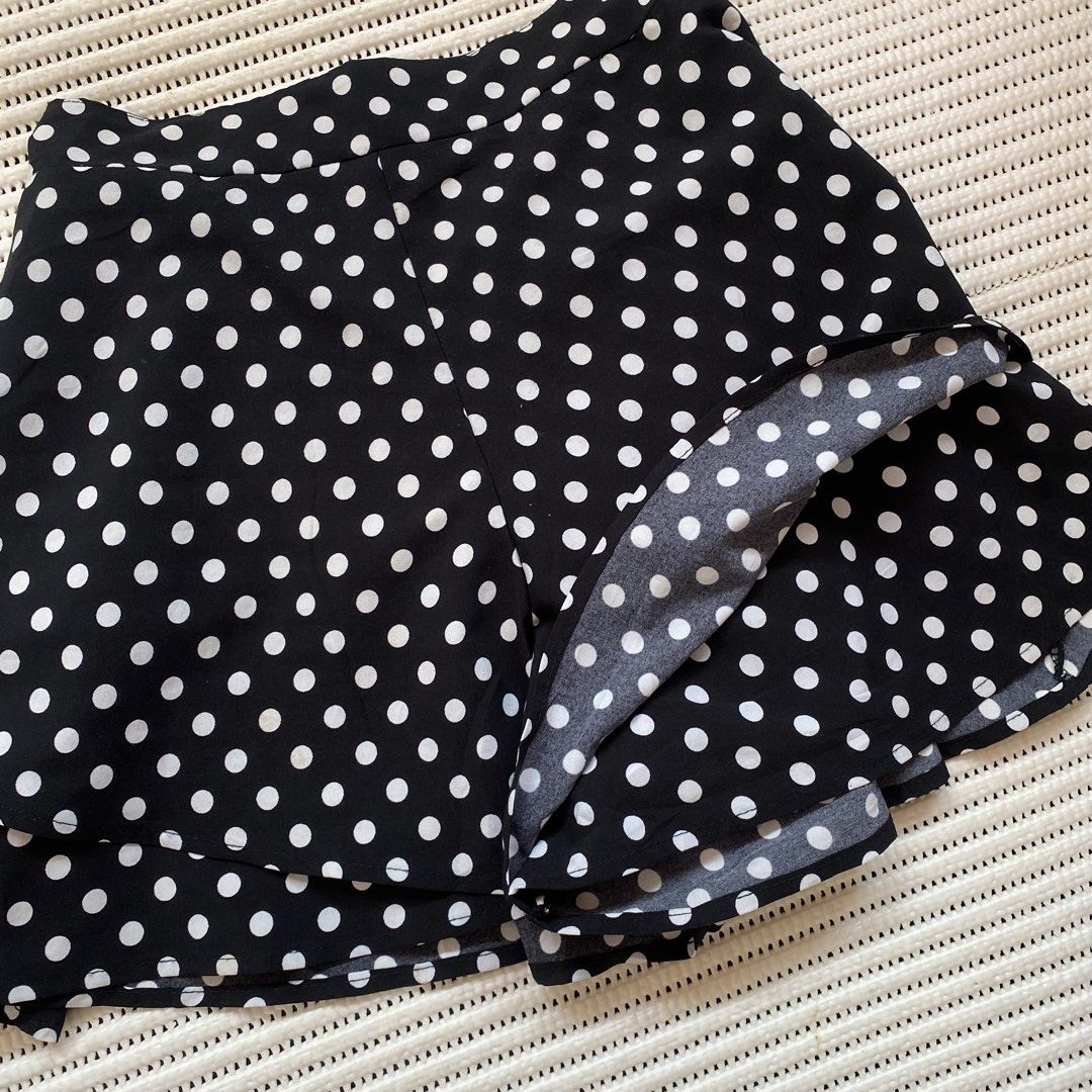 Black White Polka Dot Ruffle Skirt Shorts (Category: Skirts) located in Iloilo. Submitted by luckyeagle_1c5618 (Listing ID 1460697205, Image 2). Description: - Cute black and white polka dot design - Skirt shorts style for comfort and style - Ruffle hem detail for a feminine touch - Elastic waistband for a perfect fit - Versatile for casual wear or fun outings - Easy to pair with any top.