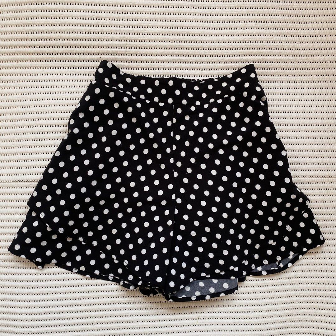 Black White Polka Dot Ruffle Skirt Shorts (Category: Skirts) located in Iloilo. Submitted by luckyeagle_1c5618 (Listing ID 1460697205, Image 1). Description: - Cute black and white polka dot design - Skirt shorts style for comfort and style - Ruffle hem detail for a feminine touch - Elastic waistband for a perfect fit - Versatile for casual wear or fun outings - Easy to pair with any top.