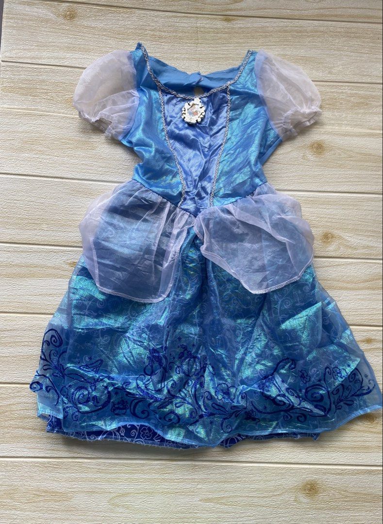 blue Cinderella costume dress (Category: Babies & Kids Fashion) located in Cebu City. Submitted by yjainani (Listing ID 1460526772, Image 1). Description: blue Cinderella costume dress featuring sheer puff sleeves and a character cameo pendant at the neckline.