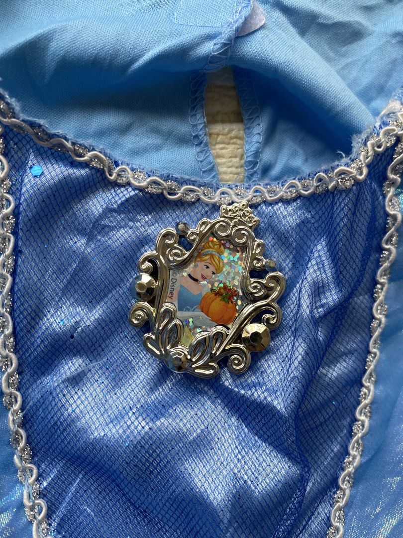 blue Cinderella costume dress (Category: Babies & Kids Fashion) located in Cebu City. Submitted by yjainani (Listing ID 1460526772, Image 2). Description: blue Cinderella costume dress featuring sheer puff sleeves and a character cameo pendant at the neckline.