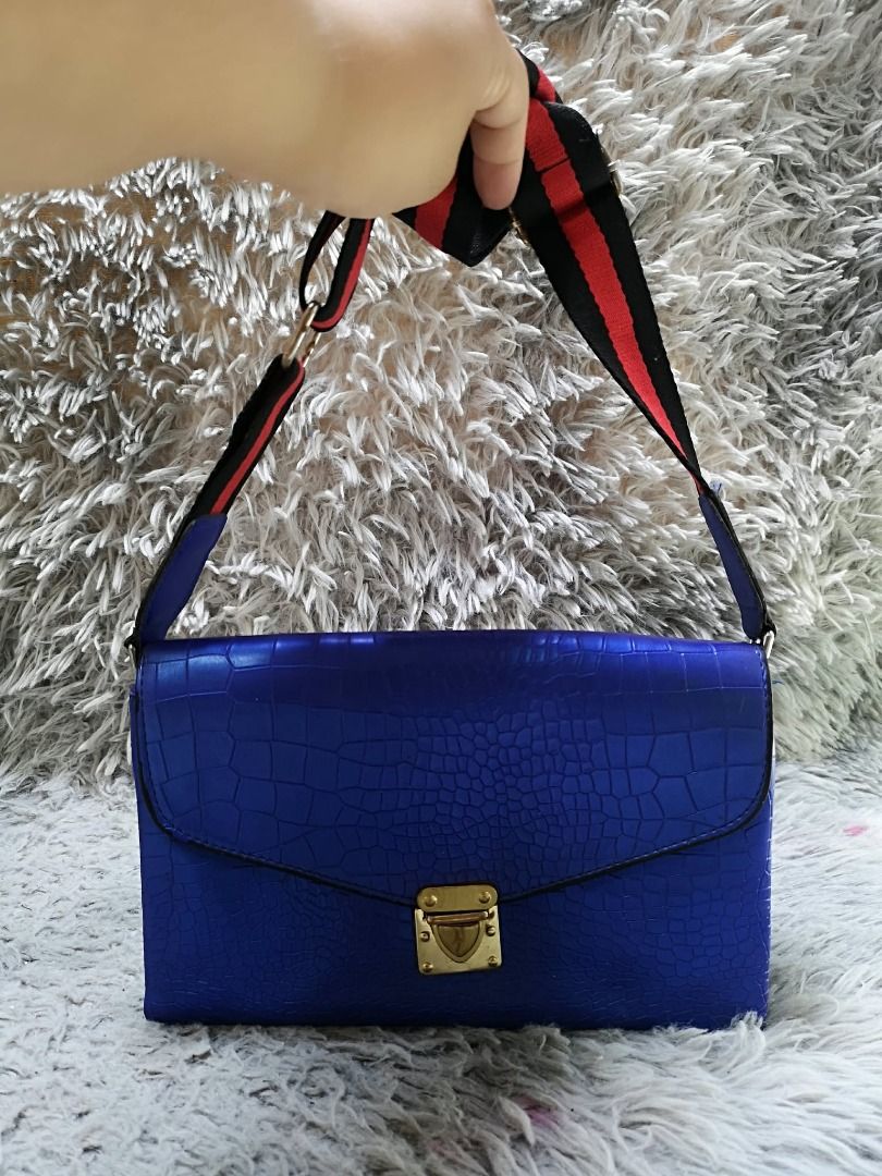 Blue Exotic leather Push Lock Crossbody Bag (Category: Cross-body Bags) located in Santa Cruz. Submitted by jmy_surplus.2 (Listing ID 1460527587, Image 3). Description: Size ; L -7 W - 10 Color ; Blue Type ; Crossbody bag Brand ; No Brand Material ; Leather Style ; Blue leather crossbody bag LR 173 JMY 5 Batch #218.