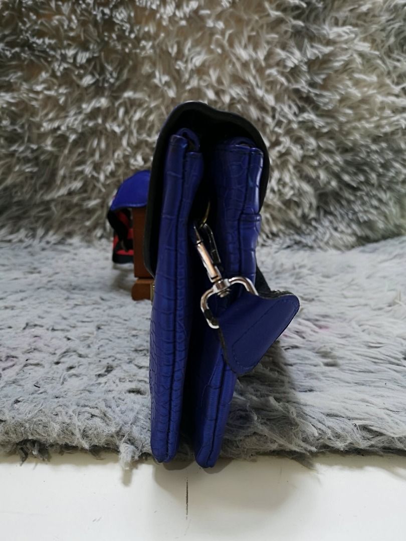 Blue Exotic leather Push Lock Crossbody Bag (Category: Cross-body Bags) located in Santa Cruz. Submitted by jmy_surplus.2 (Listing ID 1460527587, Image 2). Description: Size ; L -7 W - 10 Color ; Blue Type ; Crossbody bag Brand ; No Brand Material ; Leather Style ; Blue leather crossbody bag LR 173 JMY 5 Batch #218.