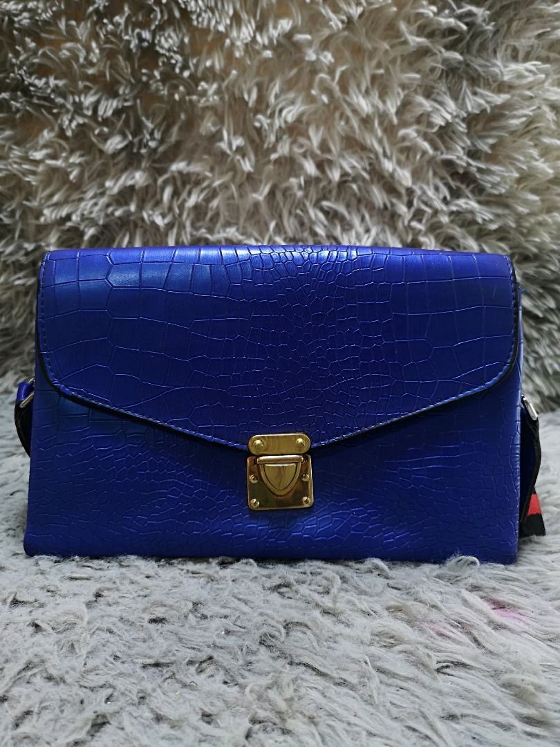 Blue Exotic leather Push Lock Crossbody Bag (Category: Cross-body Bags) located in Santa Cruz. Submitted by jmy_surplus.2 (Listing ID 1460527587, Image 1). Description: Size ; L -7 W - 10 Color ; Blue Type ; Crossbody bag Brand ; No Brand Material ; Leather Style ; Blue leather crossbody bag LR 173 JMY 5 Batch #218.