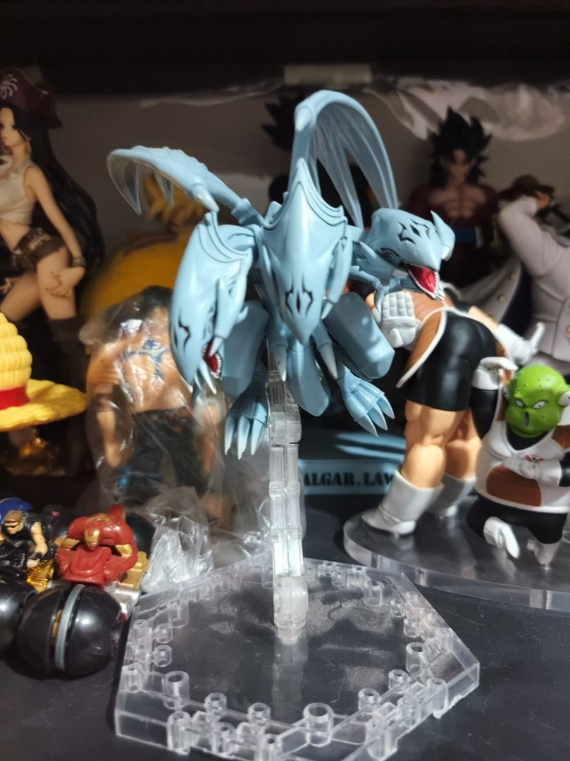 Blue-Eyes White Dragon Action Figure with Stand (Category: Figurines & Statues) located in San Leonardo. Submitted by burgossanleonardo.12345 (Listing ID 1460685367, Image 1). Description: - Detailed Blue-Eyes White Dragon action figure - Approximately 6 inches tall - Comes with a clear display stand (as pictured) - A must-have for any Yu-Gi-Oh! fan - Looks awesome!.