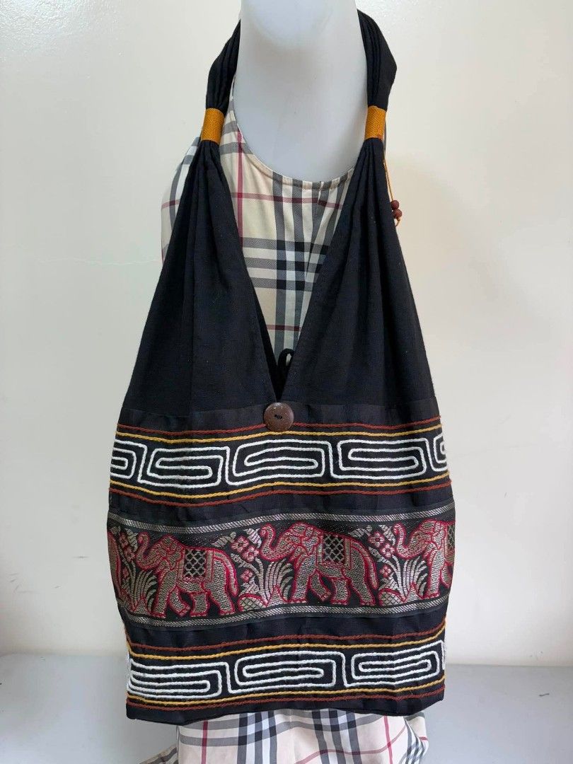 Boho Elephant Print Shoulder Bag with Tassel Details (Category: Shoulder Bags) located in Manila. Submitted by ukaygandamo (Listing ID 1460650974, Image 1). Description: - Stylish black shoulder bag - Unique elephant and geometric print - Secure wooden button closure - Decorative tassels with wooden beads - Interior zippered pocket for essentials - Ideal for everyday wear or travel - Eye-catching and distinctive design.
