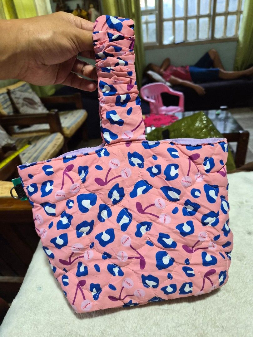 Bonidee Padded Pouch with Cherry and Leopard Print (Category: Purses & Pouches) located in Mandaue City. Submitted by chuchi152615 (Listing ID 1460629160, Image 3). Description: - Cute padded pouch from Bonidee - Features fun pink cherry and leopard print - Light purple lining with a small inner pocket - Includes a handle for easy carrying - Ideal for organizing small items.