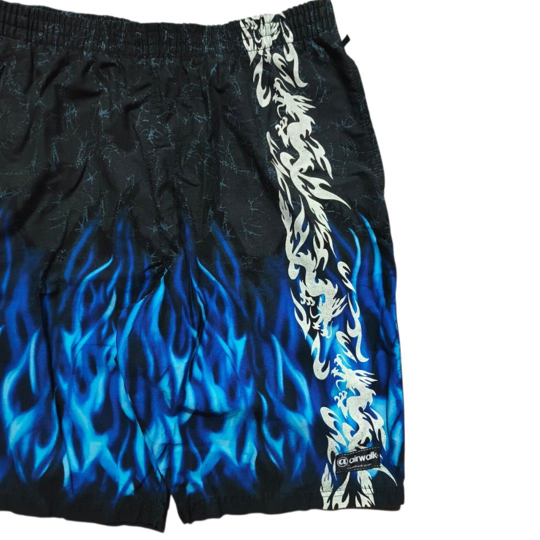 BOOT Airwalk Flame Dragon Print Board Shorts (Category: Swim Trunks & Board Shorts) located in Antipolo. Submitted by soon2byours_ (Listing ID 1460654928, Image 3). Description: Dimensions (laid flat): Width: 31" on tape measure (not stretched) Length: 22½" Hem: 10" [Cut tags] Flaws: graphic fading sa dragon & missing lace Color Rate: 9.5/10 Condition: ALMOST EXCELLENT COLOR MAY VARY DUE TO LIGHTING!.
