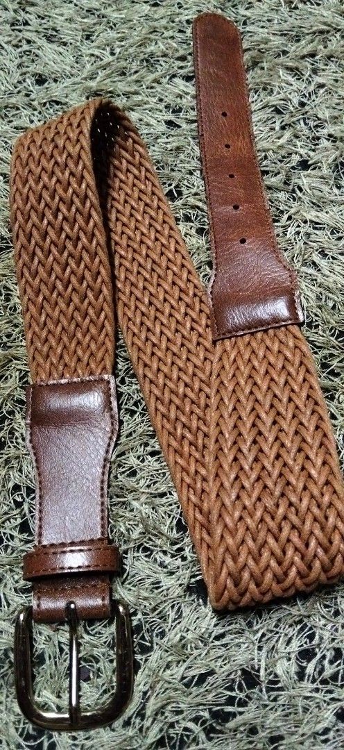 BRAIDED PURE Woven Leather Belt (Category: Activewear) located in Paranaque City. Submitted by michael-08 (Listing ID 1460532922, Image 2). Description: - Brown woven leather belt - Brown leather accents - Classic buckle closure - Stretchy braided design - Ideal for casual and smart casual outfits - Versatile wardrobe addition WALA PO ISSUE GOOD CONDITION LEATHER LIKE A NEW BODY WAISTLINE 25 to 32 MAXIMUM LENGTH 35 .