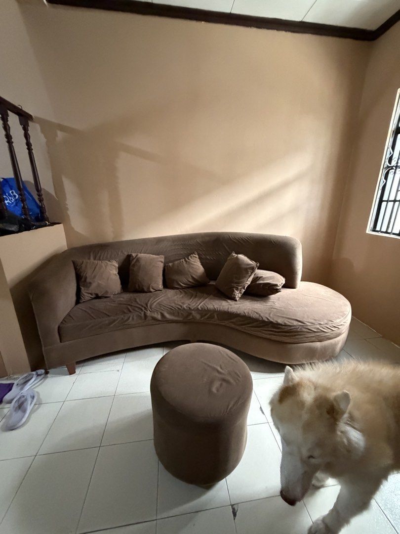 Brown Curved Sofa (Category: Sofas) located in Quezon City. Submitted by siyam_nine (Listing ID 1460695575, Image 2). Description: Curved Brown Sofa Solid Mahogany! Inclusion: Round Brown Stool 5 throw pillows RFS: Moving out Price is negotiable!.