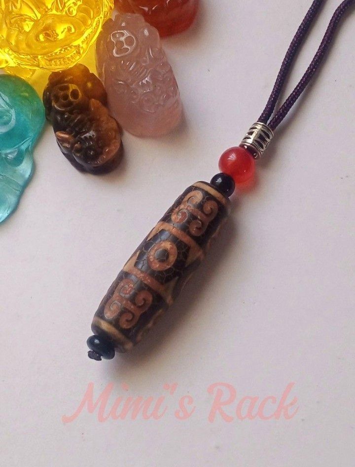 Brown Dzi Eye and Cloud Pattern Rope Necklace (Category: Necklaces) located in Taguig. Submitted by mimisrack (Listing ID 1460672636, Image 2). Description: 🤎A bold and symbolic necklace inspired by ancient Tibetan-style bead designs and earthy spiritual aesthetics -Detailed ancient-inspired patterns with crackled finish look -Accented with red and black beads for added contrast -Vintage-inspired piece with strong tribal and spiritual vibes -The