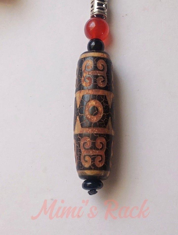 Brown Dzi Eye and Cloud Pattern Rope Necklace (Category: Necklaces) located in Taguig. Submitted by mimisrack (Listing ID 1460672636, Image 3). Description: 🤎A bold and symbolic necklace inspired by ancient Tibetan-style bead designs and earthy spiritual aesthetics -Detailed ancient-inspired patterns with crackled finish look -Accented with red and black beads for added contrast -Vintage-inspired piece with strong tribal and spiritual vibes -The