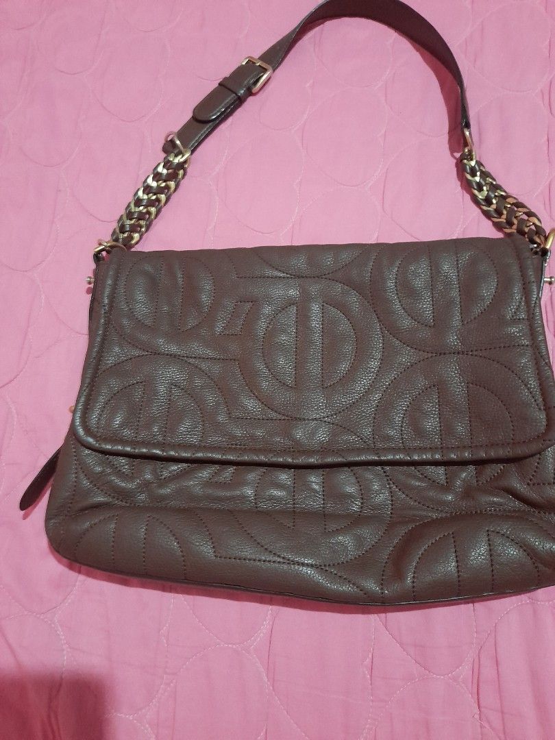 Brown Leather Embossed Shoulder Bag with Chain Strap (Category: Shoulder Bags) located in General Trias. Submitted by newberg0211 (Listing ID 1460657231, Image 1). Description: - Stylish brown leather shoulder bag - All-over embossed logo pattern for a touch of luxury - Convenient front zip pocket for quick access - Unique strap combining leather and gold chain - Secure magnetic closure inside - Ideal size for everyday use and carrying your essen