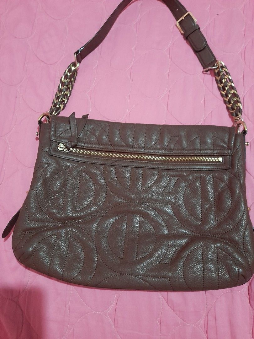 Brown Leather Embossed Shoulder Bag with Chain Strap (Category: Shoulder Bags) located in General Trias. Submitted by newberg0211 (Listing ID 1460657231, Image 2). Description: - Stylish brown leather shoulder bag - All-over embossed logo pattern for a touch of luxury - Convenient front zip pocket for quick access - Unique strap combining leather and gold chain - Secure magnetic closure inside - Ideal size for everyday use and carrying your essen