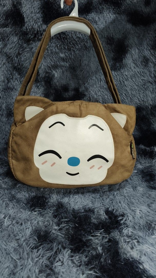 Brown Suede Cute Animal Face Shoulder Bag (Category: Shoulder Bags) located in Manila. Submitted by serenitycarlylle (Listing ID 1460704364, Image 1). Description: - Cute brown suede shoulder bag - Features a sweet animal face design - Zipper closure - Interior pockets for organization - Ideal for everyday wear or as a fun accessory.