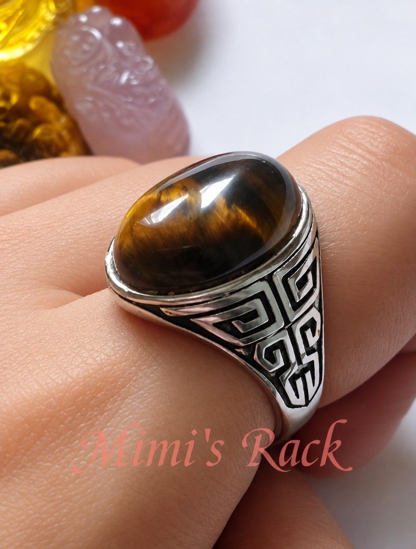 Brown Tiger's Eye Oval Vintage Design Ring (Category: Rings) located in Taguig. Submitted by mimisrack (Listing ID 1460679848, Image 2). Description: 🤎A bold tiger's eye ring with mesmerizing golden flashes that shift beautifully under the light powerful, classy, and timeless -Features a polished natural tiger's eye cabochon stone -Beautiful golden-brown chatoyancy -detailed engraved band design -Tiger's eye is associated with protection, confid