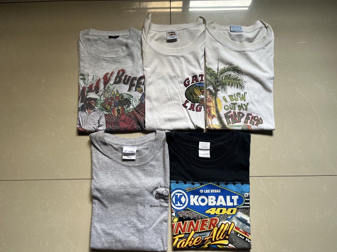 Bundle of Vintage tee’s (Category: Tshirts & Polo Shirts ) located in Angeles City. Submitted by borgiethrifts (Listing ID 1460542125, Image 1). Description: XL sizes! Negotiable! Jimmy buffet Dimes Width: 24 Length: 28 Issue: can be seen on pic Margaritaville Dimes Width: 24 Length: 28 Issue: slight neck yellowing (washable) Nastuck lang kasi sa cabinet Gatorlager Dimes Width: 24 Length: 29 Issues: same sa margaritaville (neck yellowing) Fritola