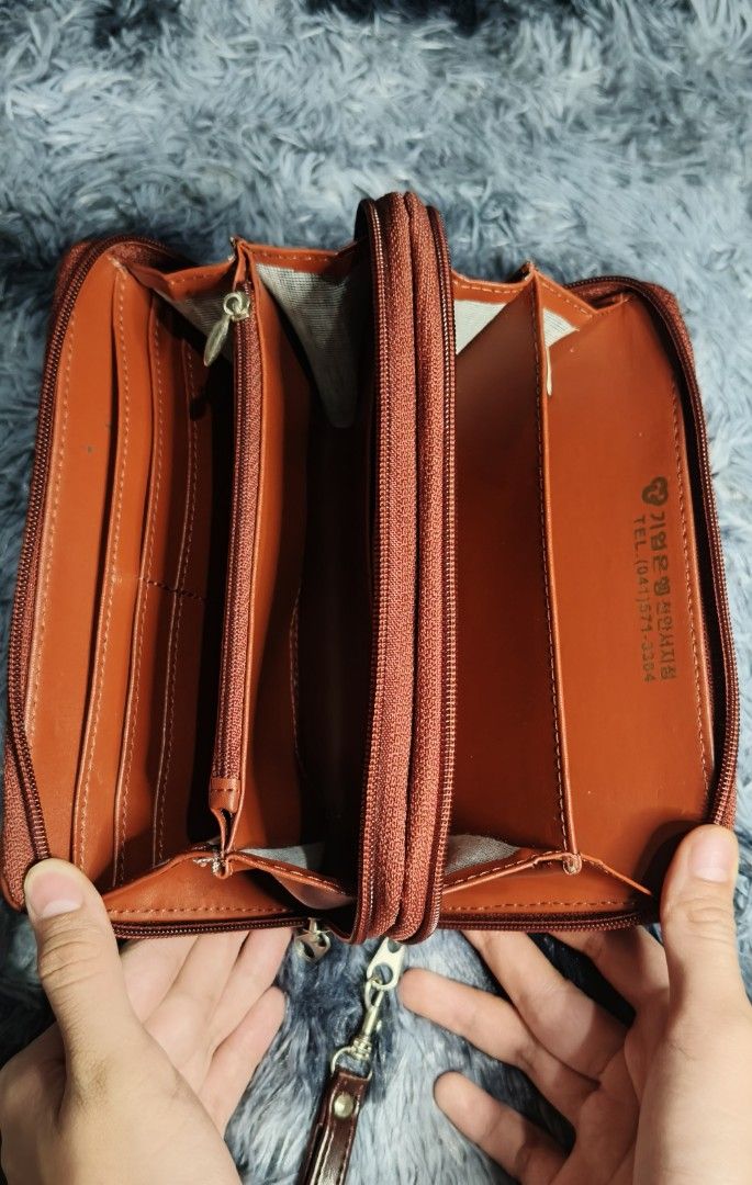 Burberry Checkered Zip Around Wallet with Wrist Strap (Category: Luxury Bags & Wallets) located in Manila. Submitted by serenitycarlylle (Listing ID 1460705275, Image 2). Description: Classic Burberry checkered wallet. Tan and red plaid pattern. Zip around closure. Interior has multiple compartments and card slots. Comes with a detachable wrist strap. Good for organizing essentials..