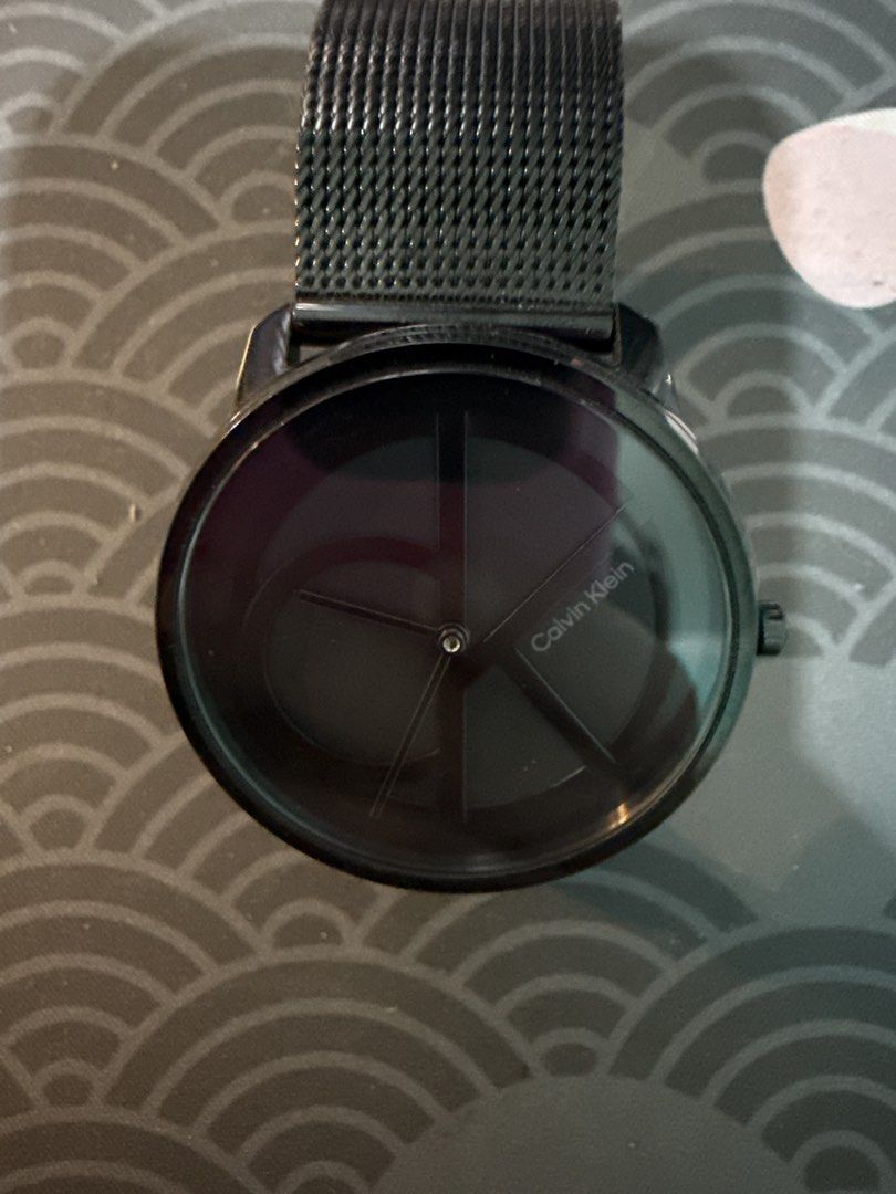 Calvin Klein Black Mesh Strap Watch (Category: Women's Watches) located in Quezon City. Submitted by shuks_9 (Listing ID 1460706609, Image 1). Description: - Brand: Calvin Klein - Color: Black - Strap: Mesh - Dial: Black, minimalist design - Style: Sleek, modern, versatile - Condition: Rarely worn - No battery No Box.