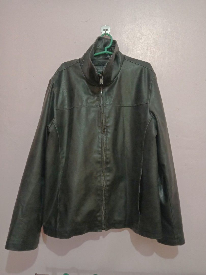 Calvin Klein leather jacket (Category: Coats, Jackets and Outerwear) located in Naga. Submitted by thrift.vincent (Listing ID 1460559229, Image 1). Description: Calvin Klein black faux leather full zip jacket in men's medium. Funnel neck collar, two side hand pockets, horizontal chest seam, and vertical center seam on the back. Calvin Klein branded metal zipper pull and small metal logo plate on the upper back. Quilted interior lining. Shell face