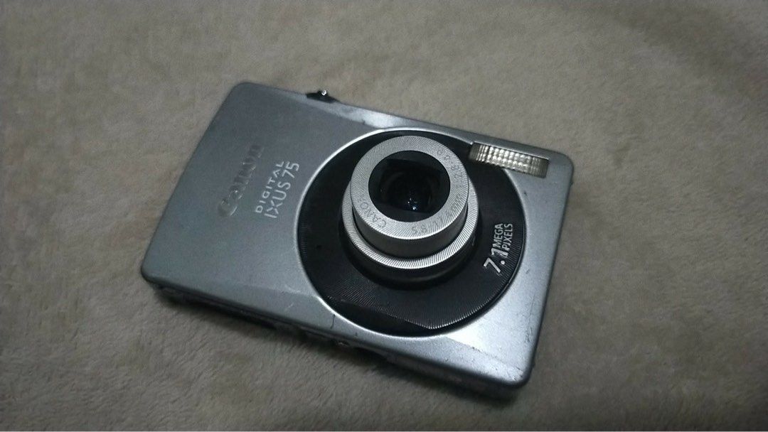 Canon IXUS 75 (Category: Cameras) located in Manila. Submitted by rosswell04 (Listing ID 1460519799, Image 3). Description: Inclusions: Canon IXUS 75 unit Battery SD Card (4gb) 2× lanyards Stickers ISSUE: * small dot sa baba ng lcd only (doesn’t affect the actual photo) 📌 MOP: GCash / MariBank / Bank Transfer 📦 MOD: J&T (FREE SHIPPING) .