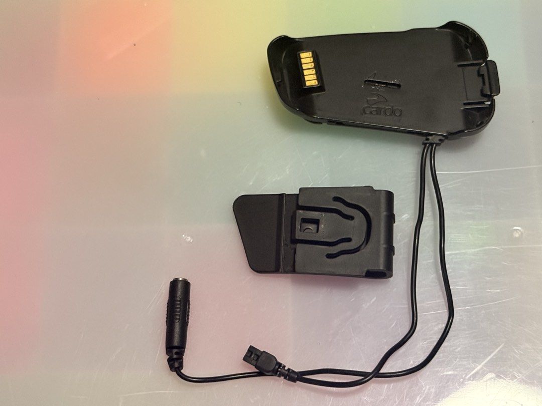 Cardo Packtalk Bold Cradle and Adapter (Category: Chargers & Cables) located in Paranaque City. Submitted by latThor (Listing ID 1460530821, Image 1). Description: - Genuine Cardo Scala Rider charger clip and adapter - Attaches securely to your helmet - comes with the clip - Can also be connected directly to helmet with the 3M double sided tape already installed and ready .